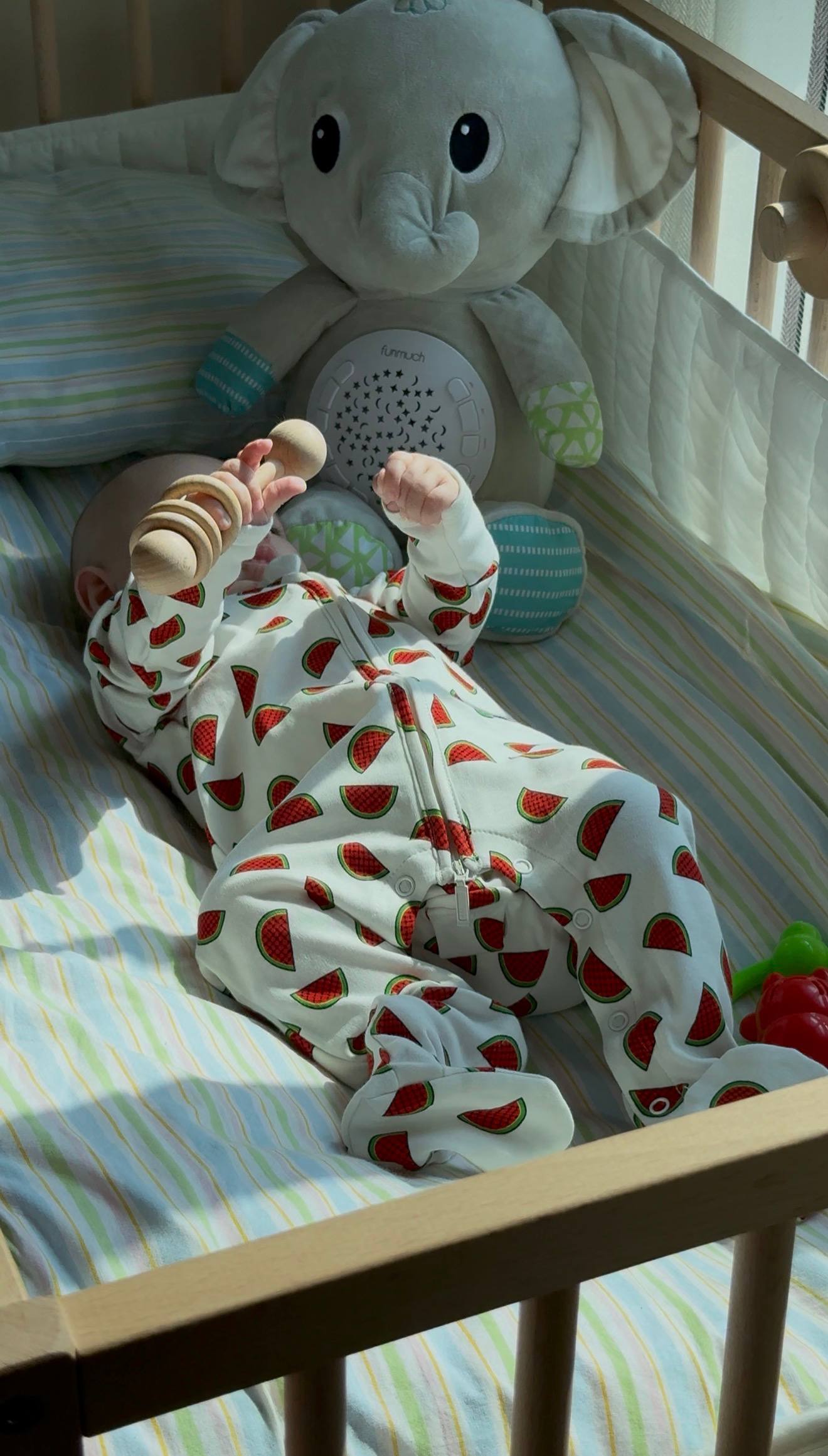 Close-up of the Lullaby Bloom Peek-a-Boo flap on an organic cotton sleepsuit
